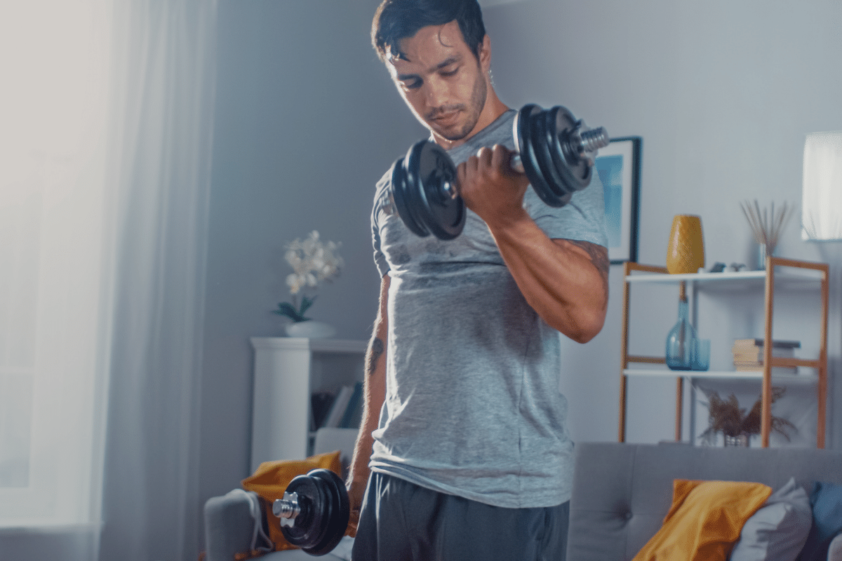 man doing a bicep curl home workout