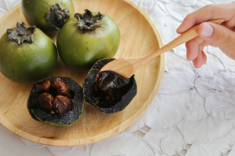 Black Sapote or Chocolate Pudding Fruit on a platter