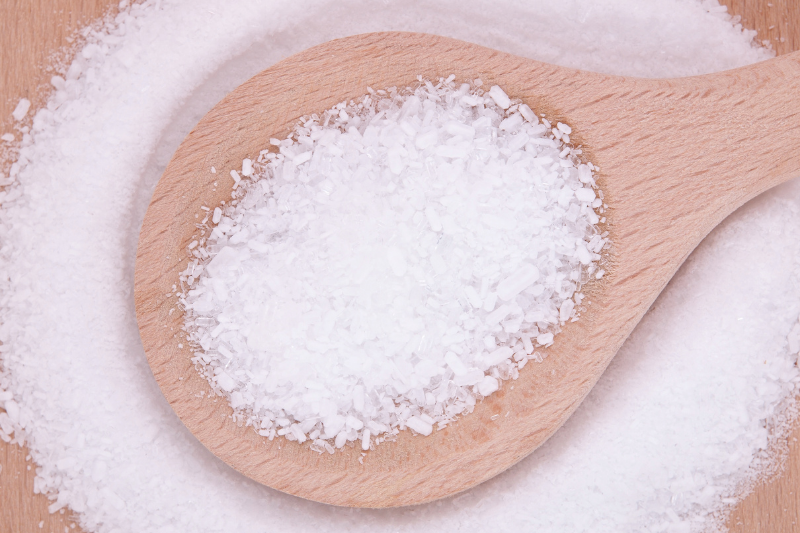 Magnesium salts on a wooden spoon