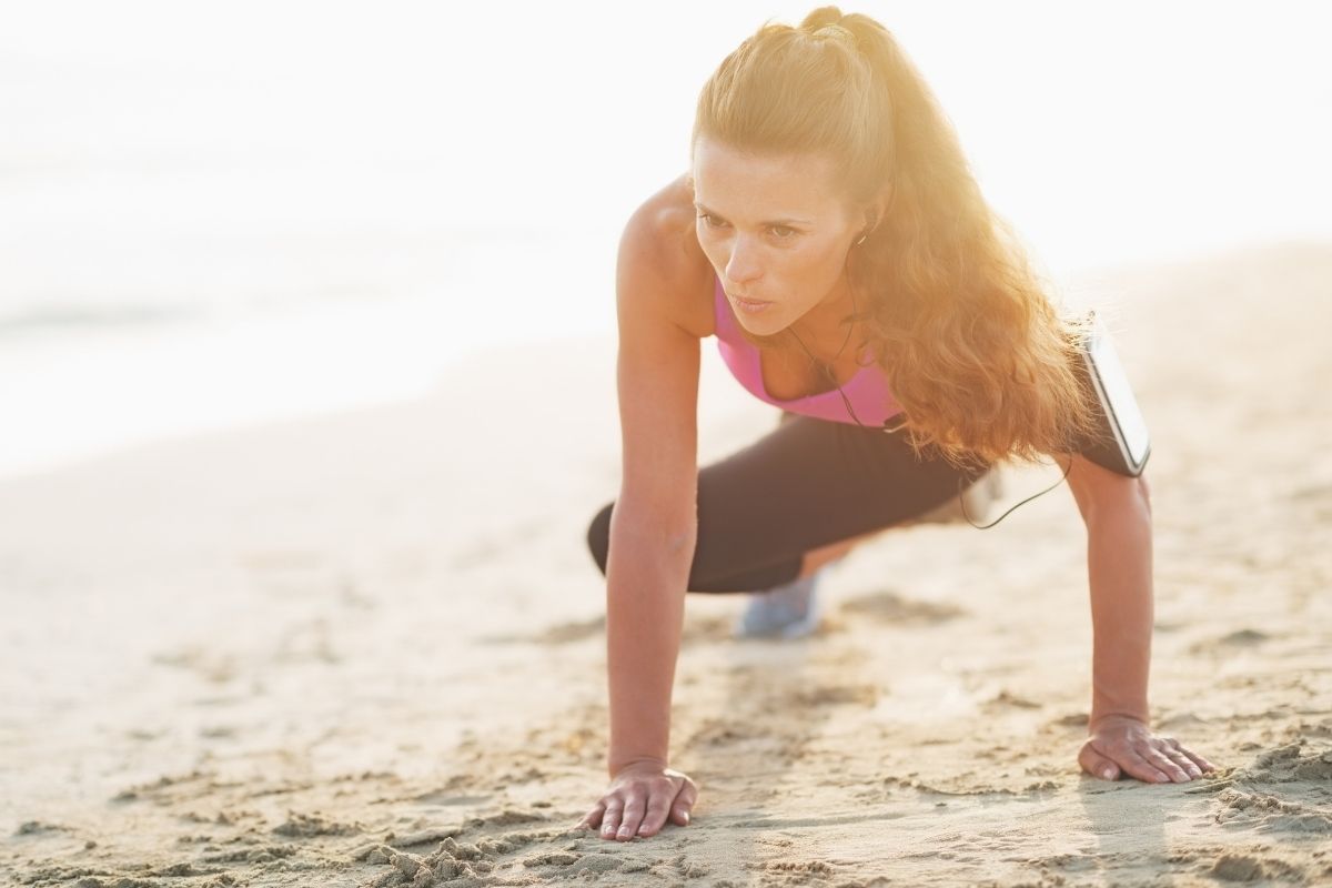 Woman exercising on beach