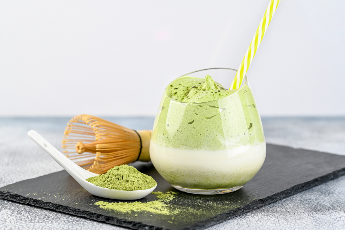 Matcha tea in a glass with a straw